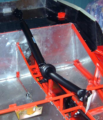 The propshaft lying above the transmission tunnel
