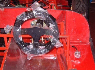 Steering wheel and bias adjuster knob