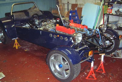 Car back on stands, with the engine in