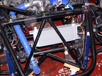 Repositioned oil cooler